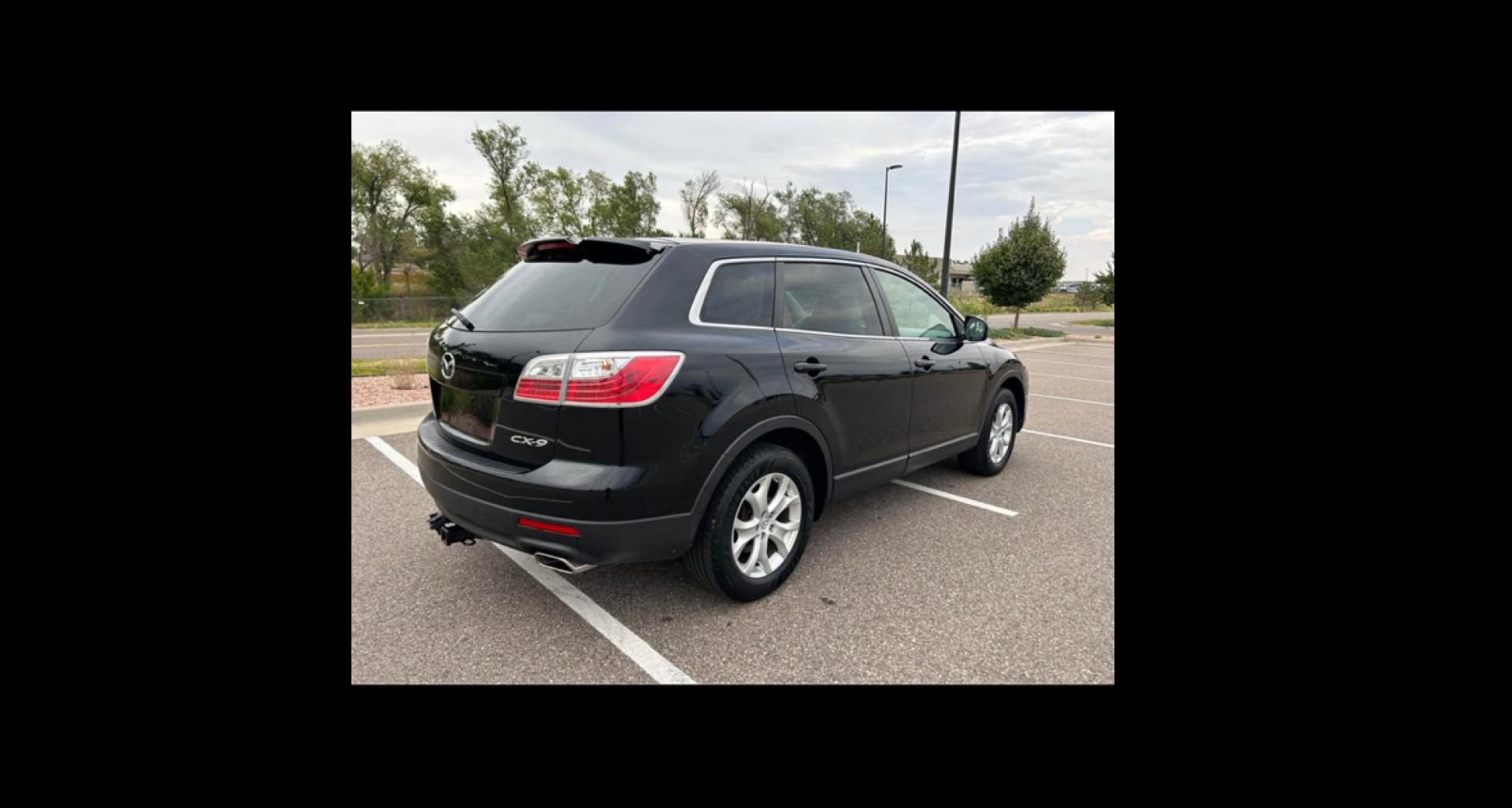 2011 Mazda CX-9 Touring (JM3TB2CAXB0) with an 3.7L V6 DOHC 24V engine, 6-Speed Automatic transmission, located at 5972 Sheridan Blvd., Arvada, CO, 80003, (303) 422-4988, 39.805470, -105.053001 - Wonderful car for the family. This vehicle's third row can accommodate 7 passengers or offer more trunk space when not in use. Drives great and runs great and is front wheel drive. The vehicles does have hail damage but runs and drives perfectly fine for a very nice smooth ride. - Photo#1