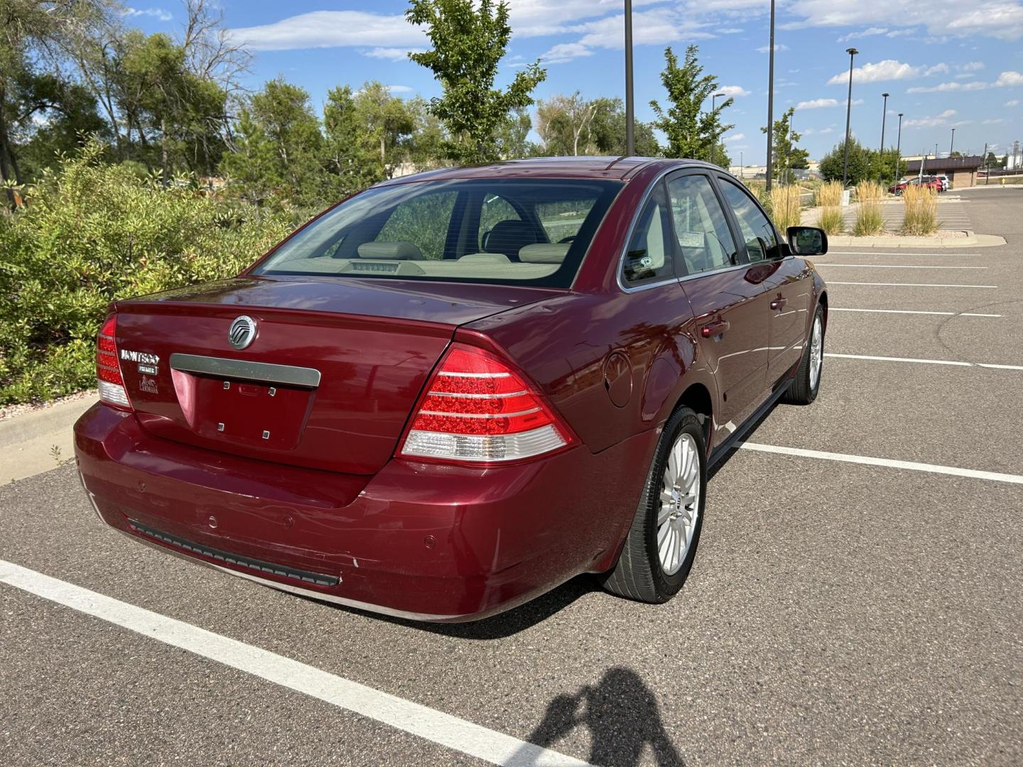 2005 Mercury Montego Premier (1MEFM421X5G) with an 3.0L V6 DOHC 24V engine, 6-Speed Automatic Overdrive transmission, located at 5972 Sheridan Blvd., Arvada, CO, 80003, (303) 422-4988, 39.805470, -105.053001 - Runs and drives great Leather seats Back up sensors Good tires Sunroof AC and heat work great Clean car Just got detailed Clean title Has hail damage - Photo#3